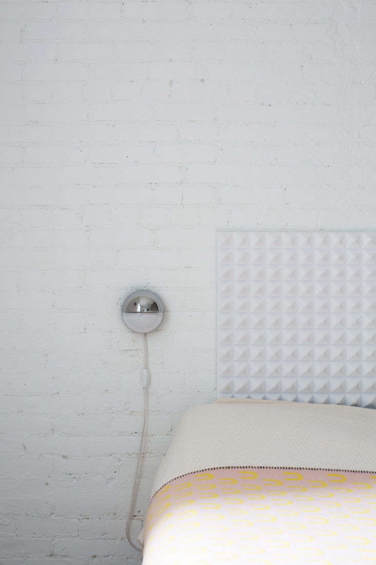 Note how the duo forwent nightstands in favor of discreet wall-mounted lights.