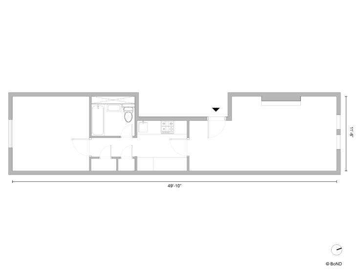 The apartment before work began, with the walled-off kitchen and bathroom in the middle of the apartment.