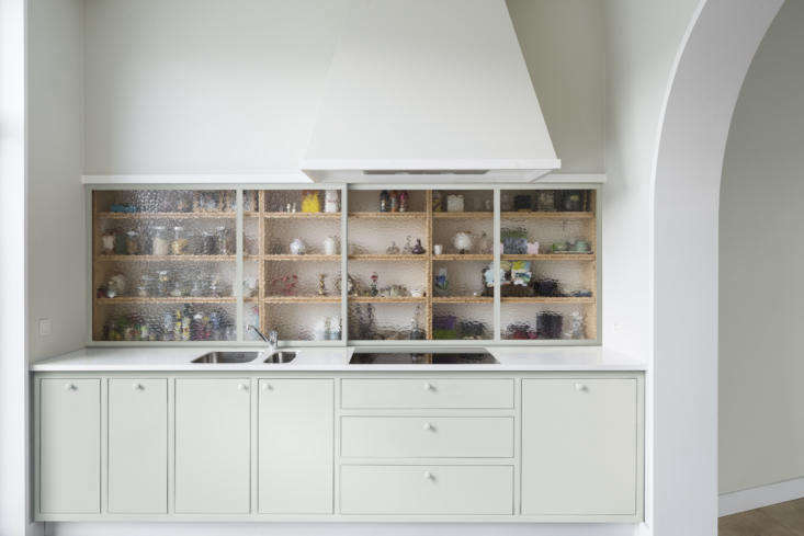 Built-ins can hide a lot of clutter and unify appliances and equipment. Photograph by Frederik Vercruysse, from Dappled Light: A Slim, Poetic Townhouse on a Tree-Lined Square in Ghent, Belgium.